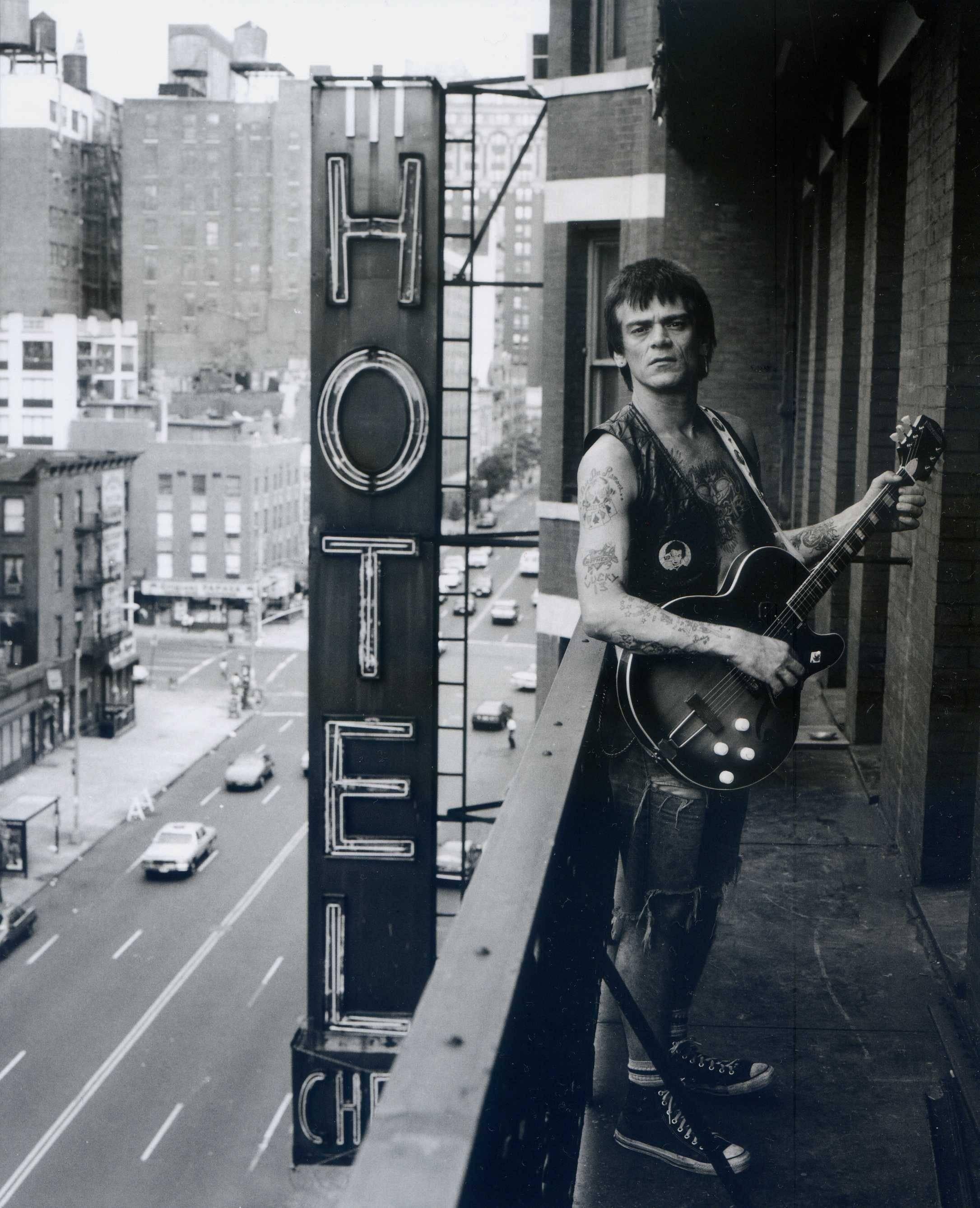 Unknown Black and White Photograph - Dee Dee Ramone on the Balcony 