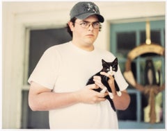 Untitled (Man Holding a Black and White Kitten), Chromogenic Print