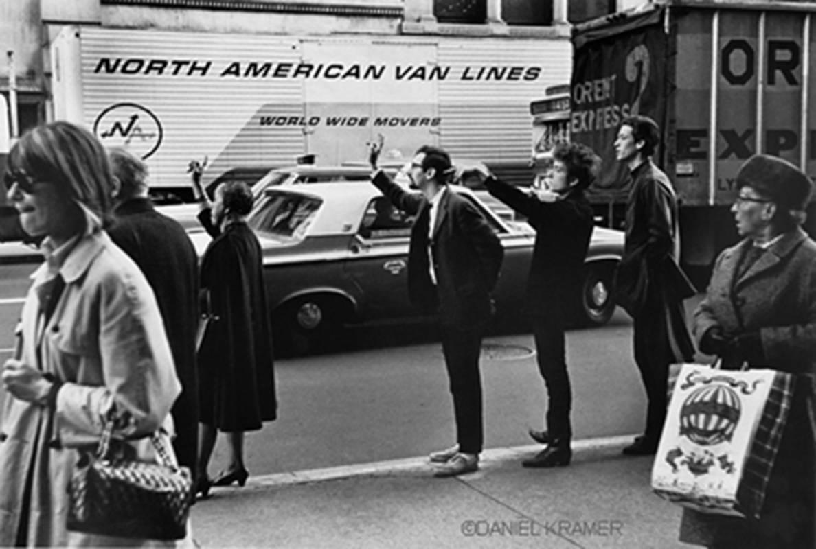 Bob Dylan hailing a cab with Peter Yarrow and John Hammond, Jr., New York