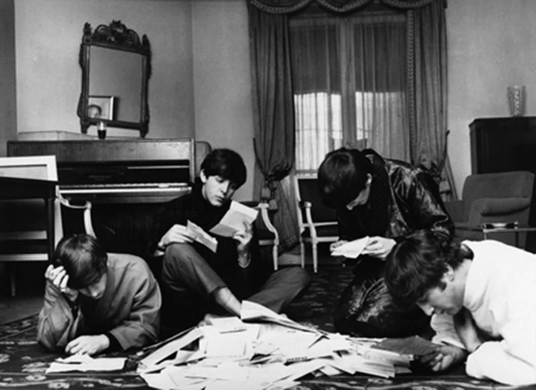 Harry Benson Black and White Photograph - The Beatles reading their fan mail, Paris