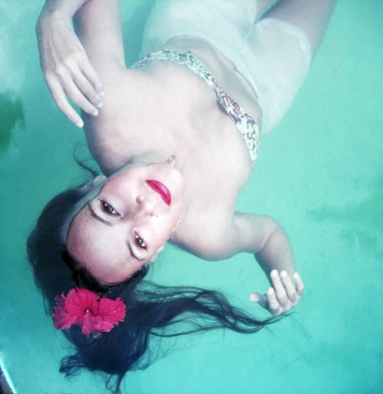 Slim Aarons Color Photograph - Dip For Dolores, 1952: Dolores Del Rio swimming in Acapulco, Mexico