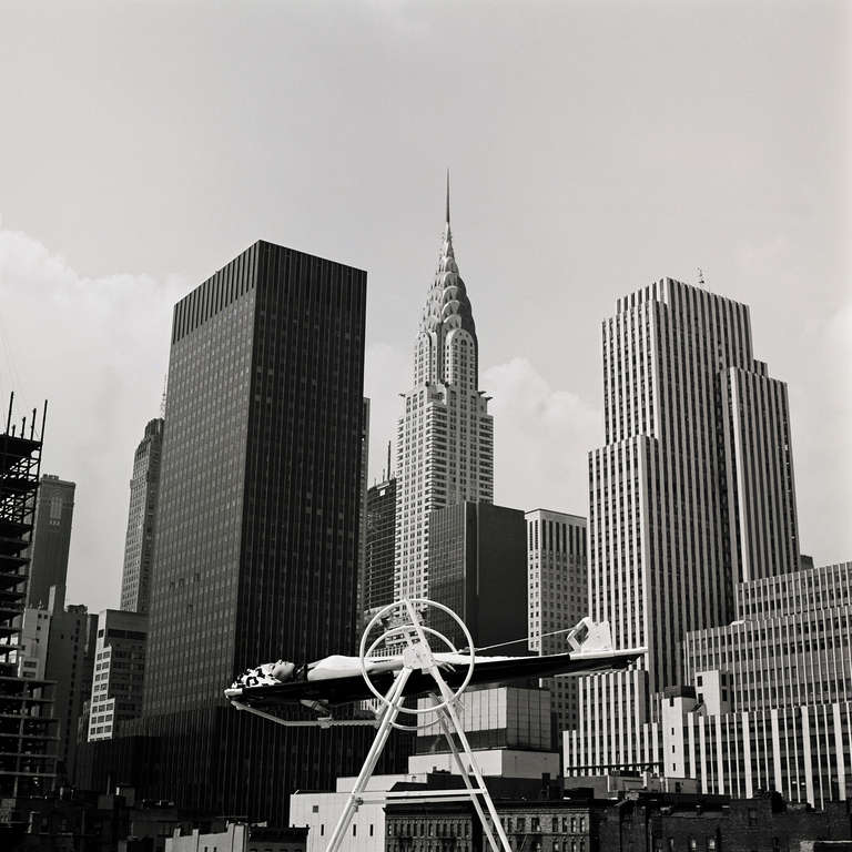 Melvin Sokolsky Black and White Photograph - Yoga Wheel, New York, Harper’s Bazaar