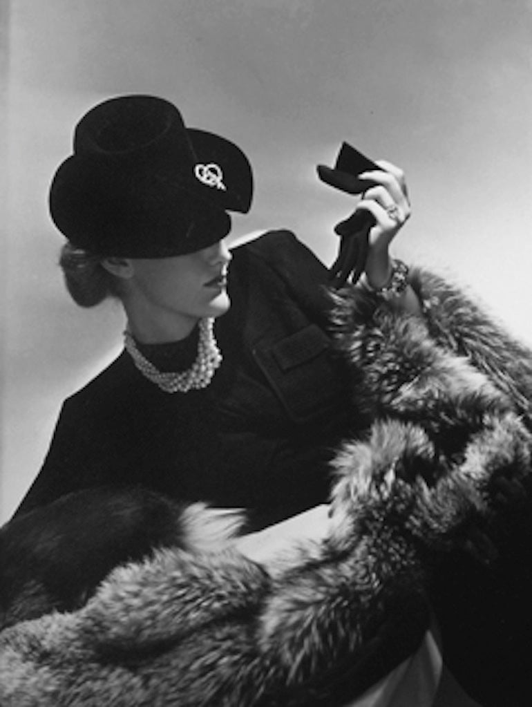 Horst P. Horst Black and White Photograph - Model in black holding glove