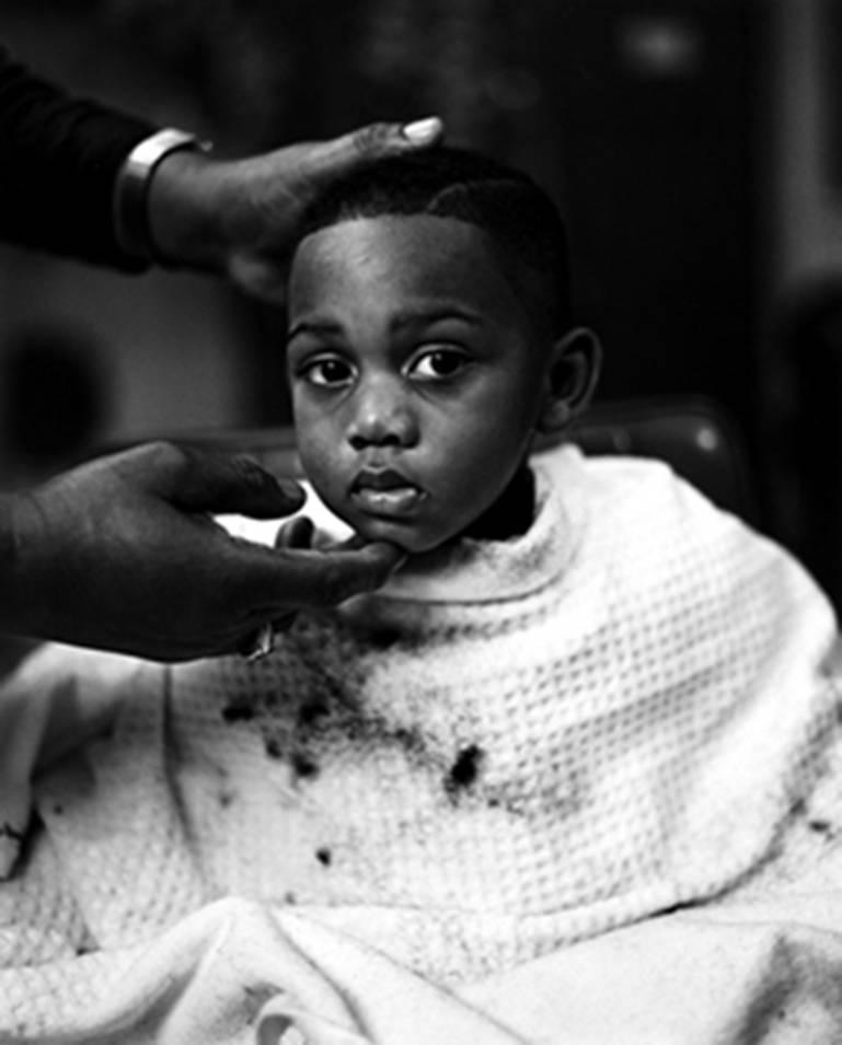 Kurt Markus Black and White Photograph - Boy getting haircut, Vicksburg, Mississippi