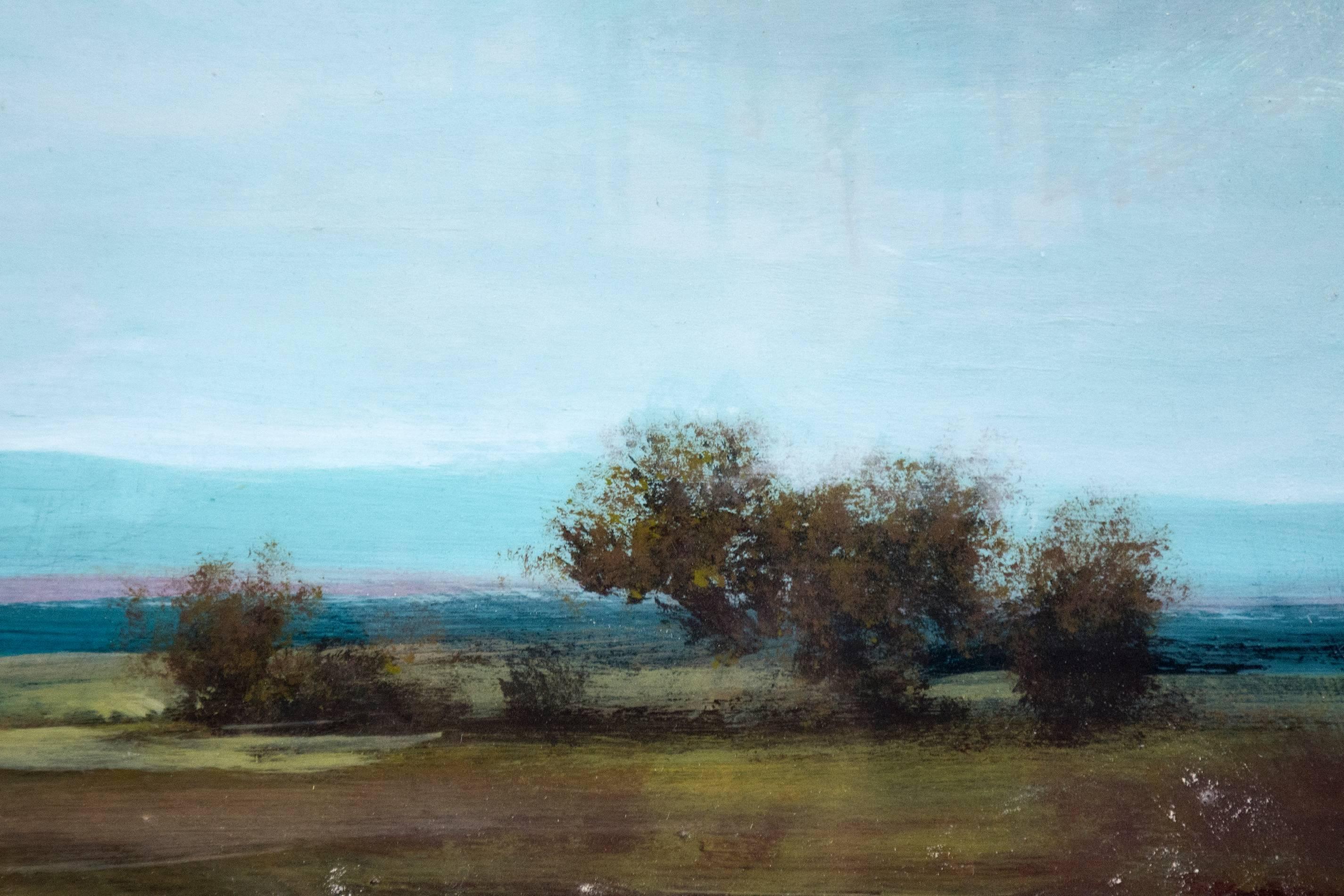 A wide summer plain, dotted with distant trees and atmospheric mountains meets a hazy sky in this acrylic and resin painting on board. The artist's skilled rendering reminiscent of the landscapes of Lorraine or Constable is covered with layers of