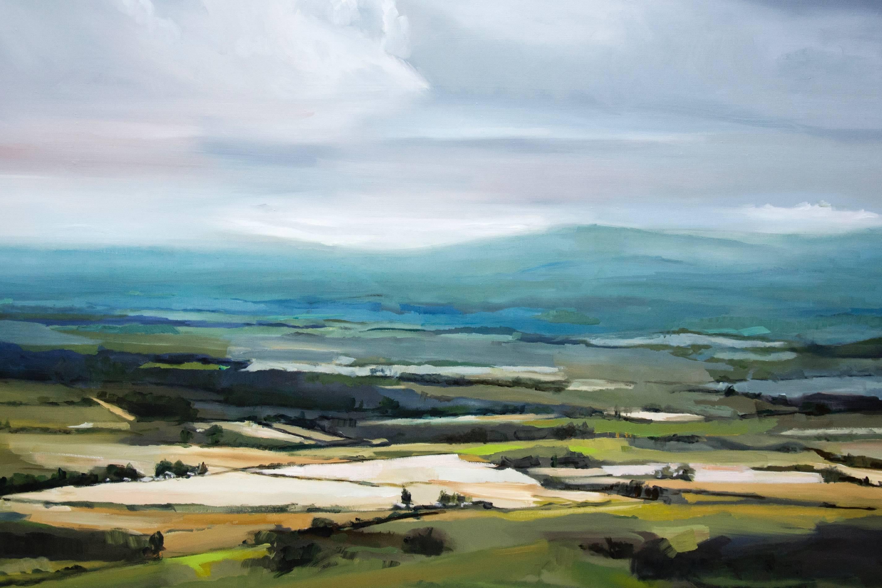 Beautiful landscape painting of a vista across the agricultural valley at the time of day when the light is perfect. The mountains in the distance define the horizon. While the painting feels effortless, it is very skilfully created.

Simon Andrew