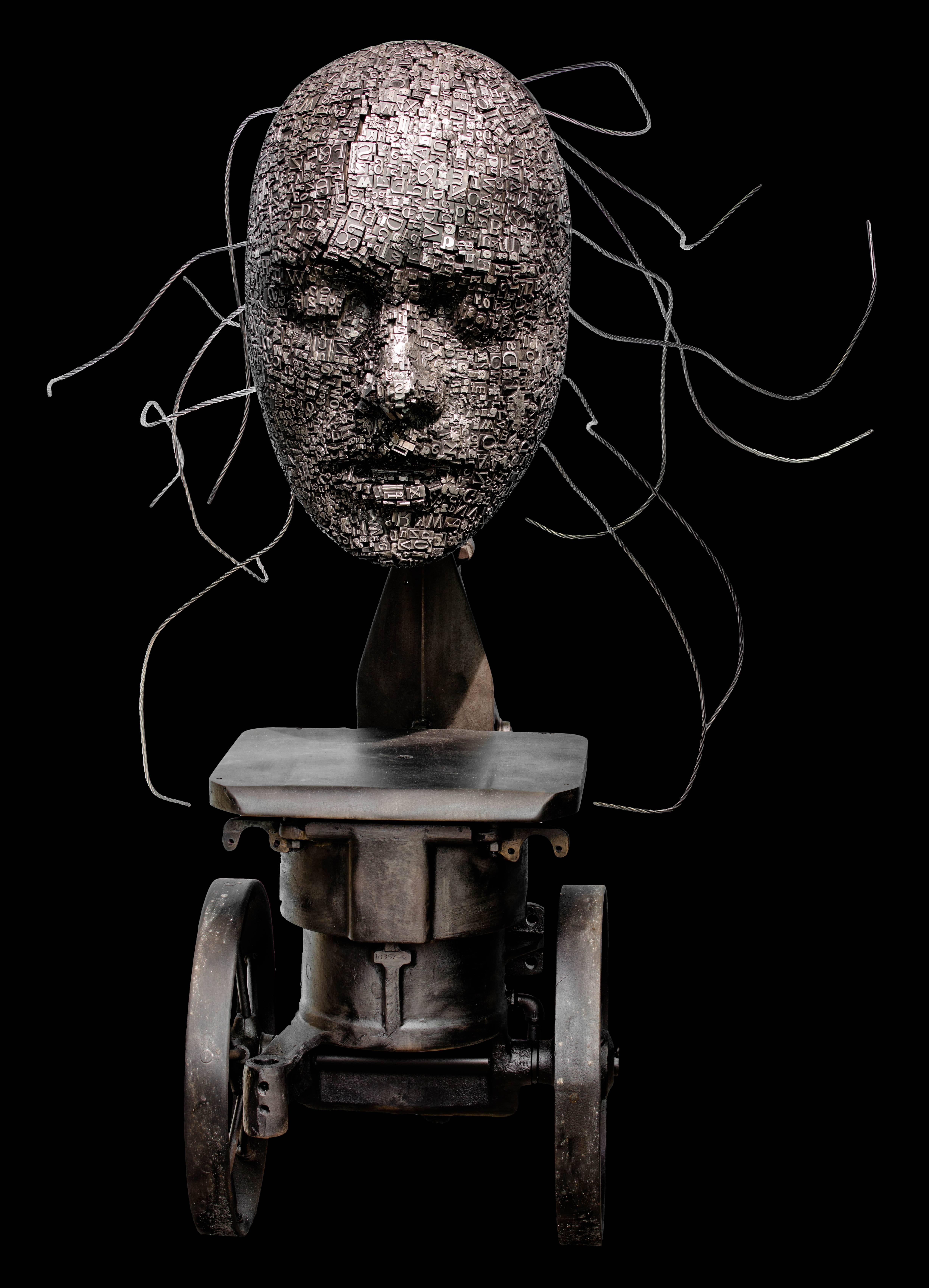 Press - tall, steam-punk inspired, human face, lead, aluminum and iron sculpture