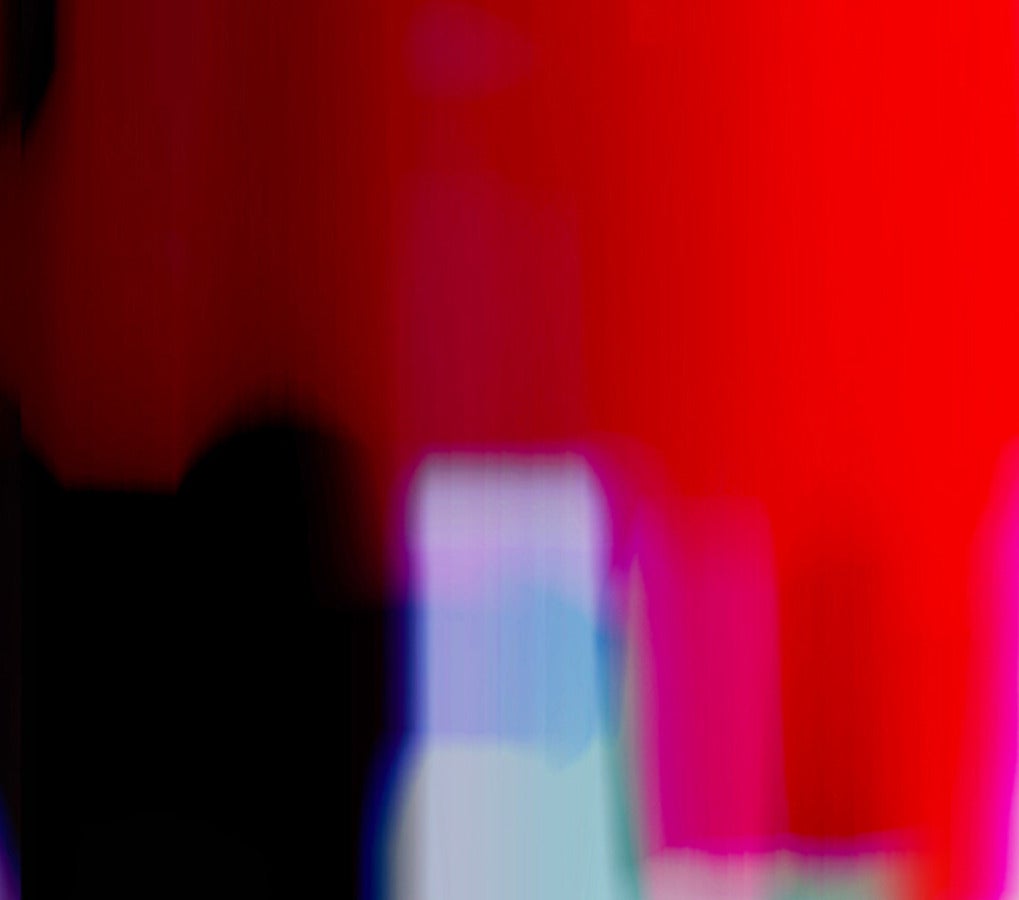 Like a fragment of blurred film, abstract shapes saturated in red, fuschia, violet, green, blue and white flicker from right to left in this five feet long mixed media work. 

The work begins with an archival chromogenic print (1/1) mounted on a