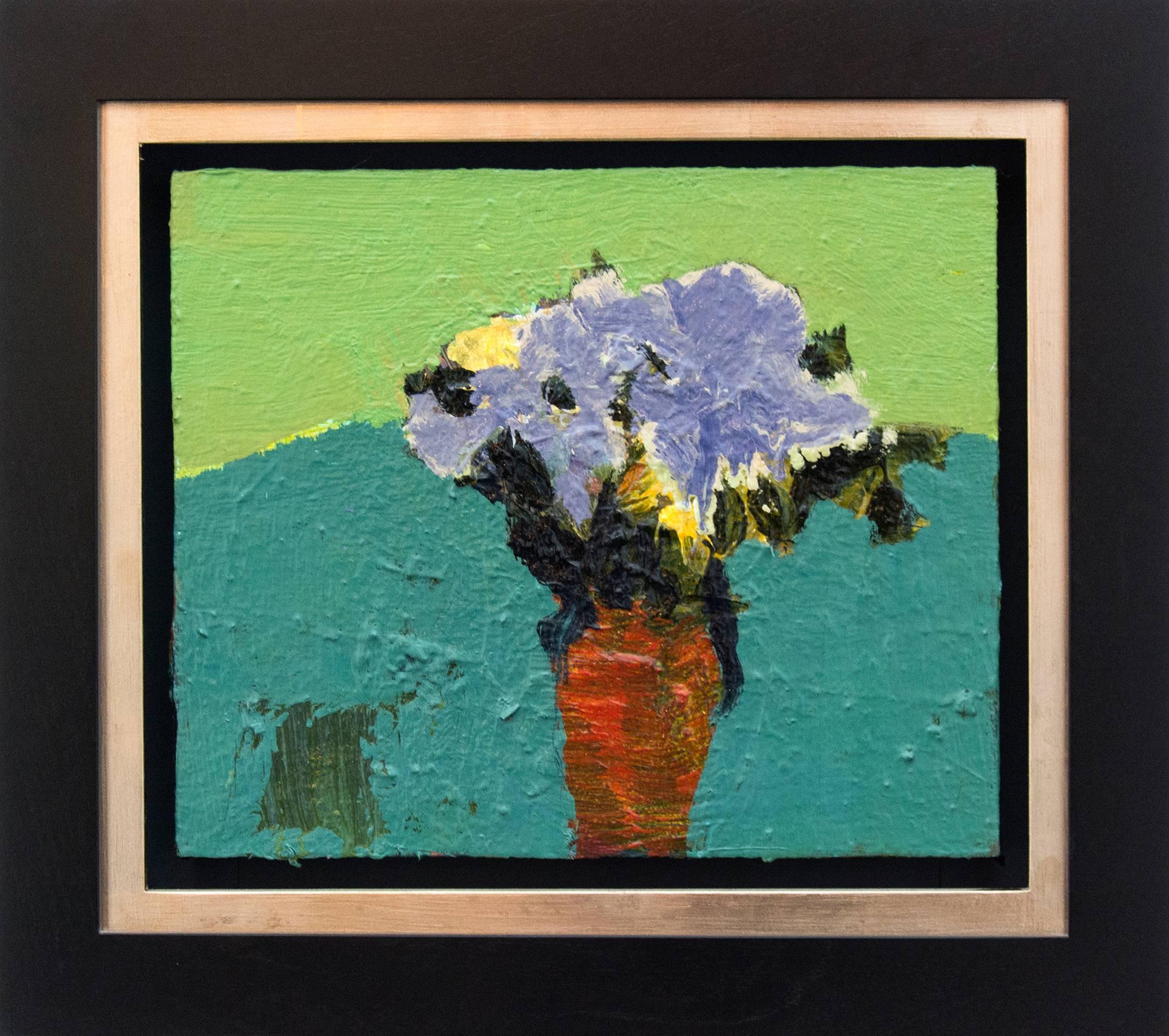 In layers of thick, expressive brushwork, flowers of mauve touched with yellow and white framed by dark, forest green leaves in a narrow orange vase are on a divided ground of teal and lime green in this 12 inches wide oil on linen. 

The bold