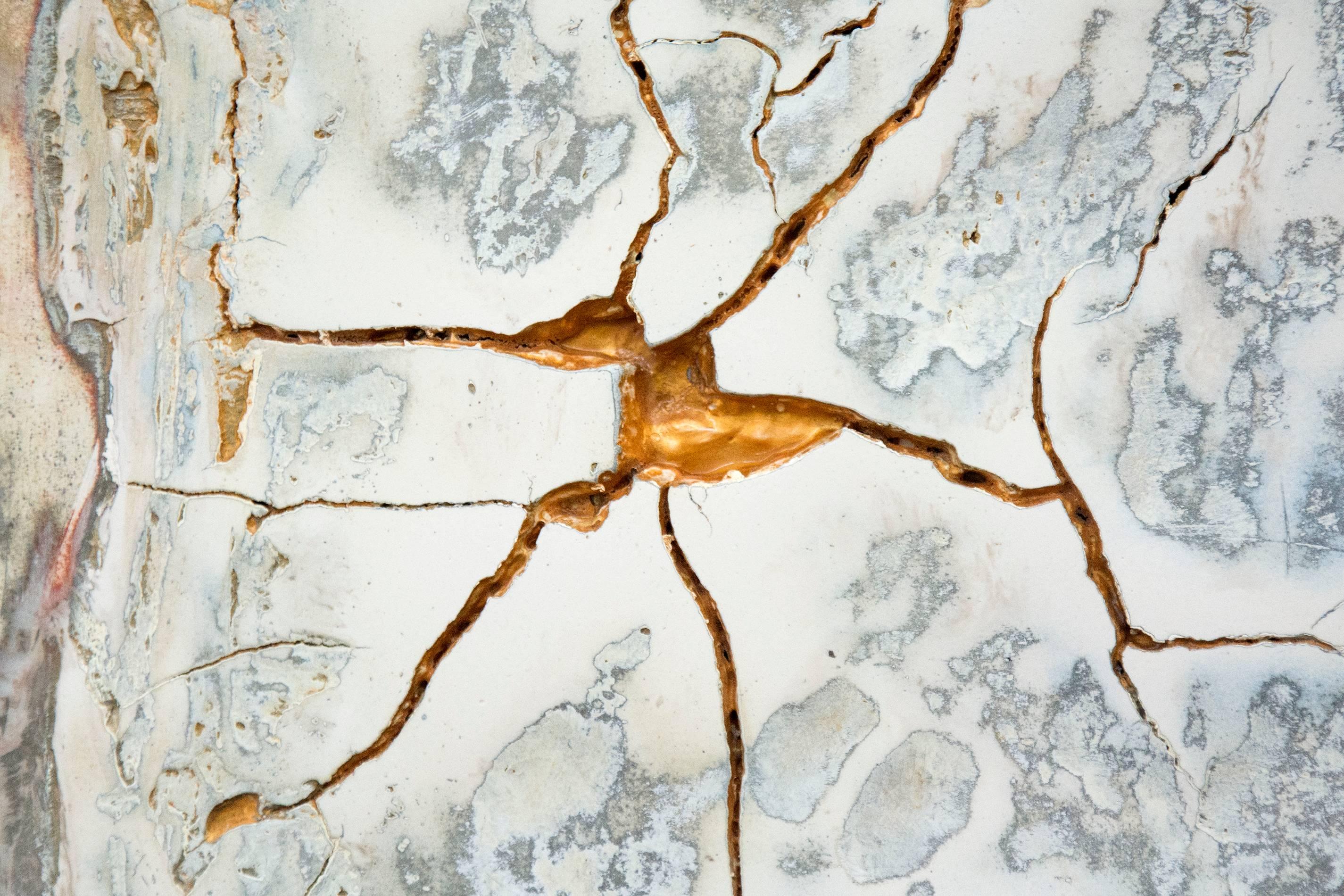 A narrative of organic shapes, cracks, lines and dents articulated in plaster and pigment -- Prussian blue, Payne's gray, ochre and reflective gold -- suggests an ancient palimpsest or Venetian fresco. 

Naim's artwork explores the creative