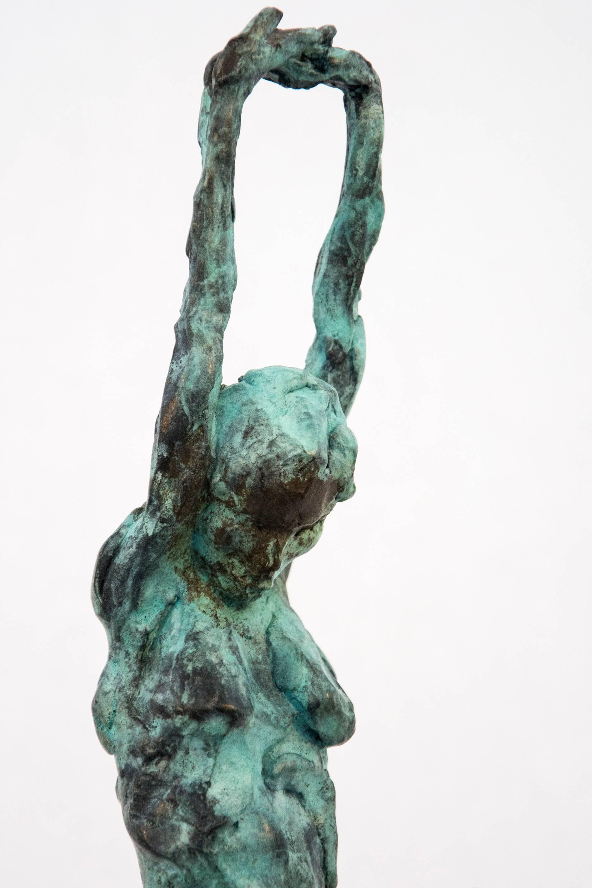 This bronze statuette of a female nude with arms stretched and straining above the head, the stabilizing legs on uneven ground was created rapidly in gestures that verge on abstraction. Tosczak’s bronze sculptures are marked by a dynamic formalism