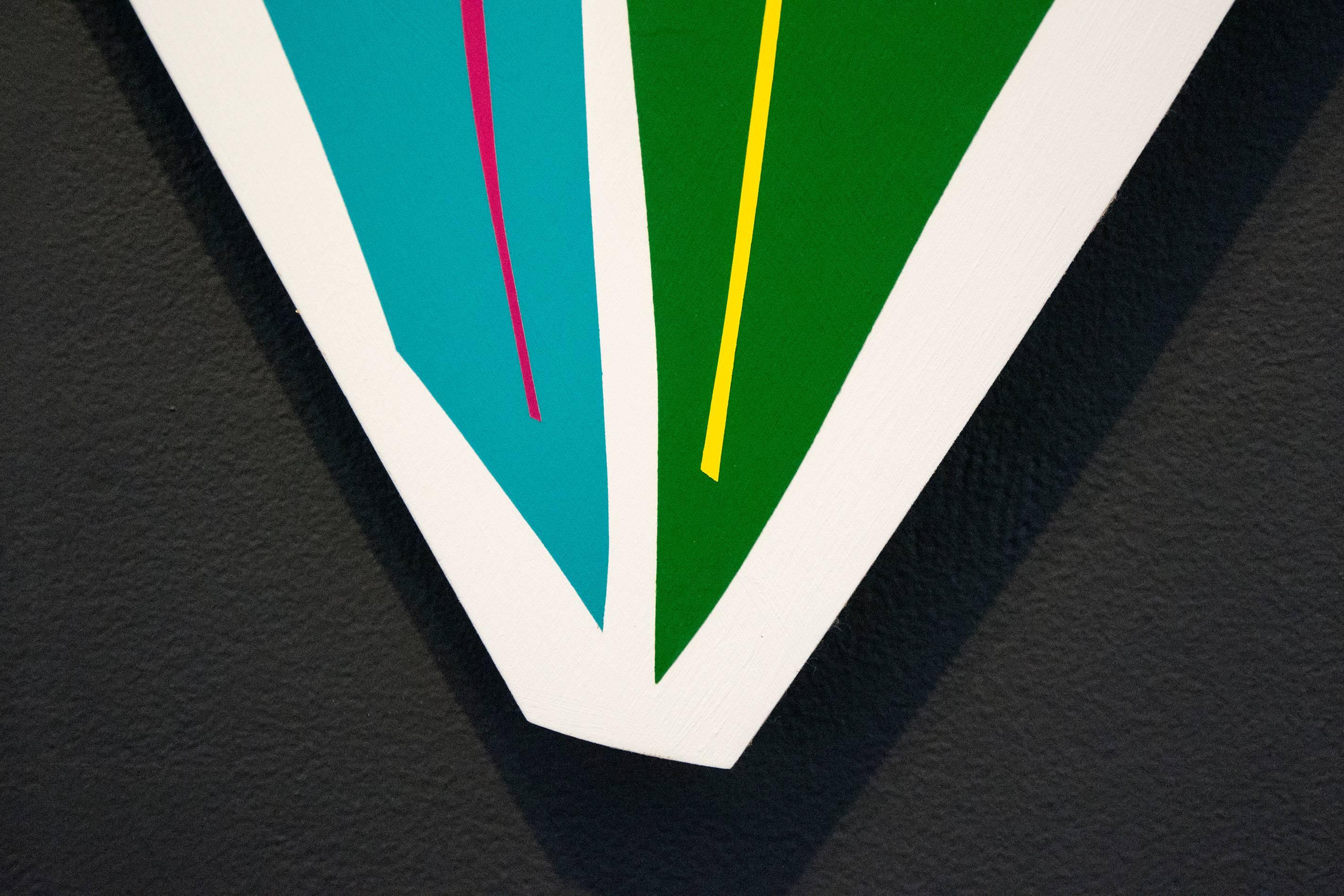 Aron Hill’s compelling abstract artwork often explores organic shapes and bright colours. This piece on a shaped panel features a divided leaf shape in aqua and Kelly green against a white backdrop—magenta and yellow lines add interest. Hill’s work,