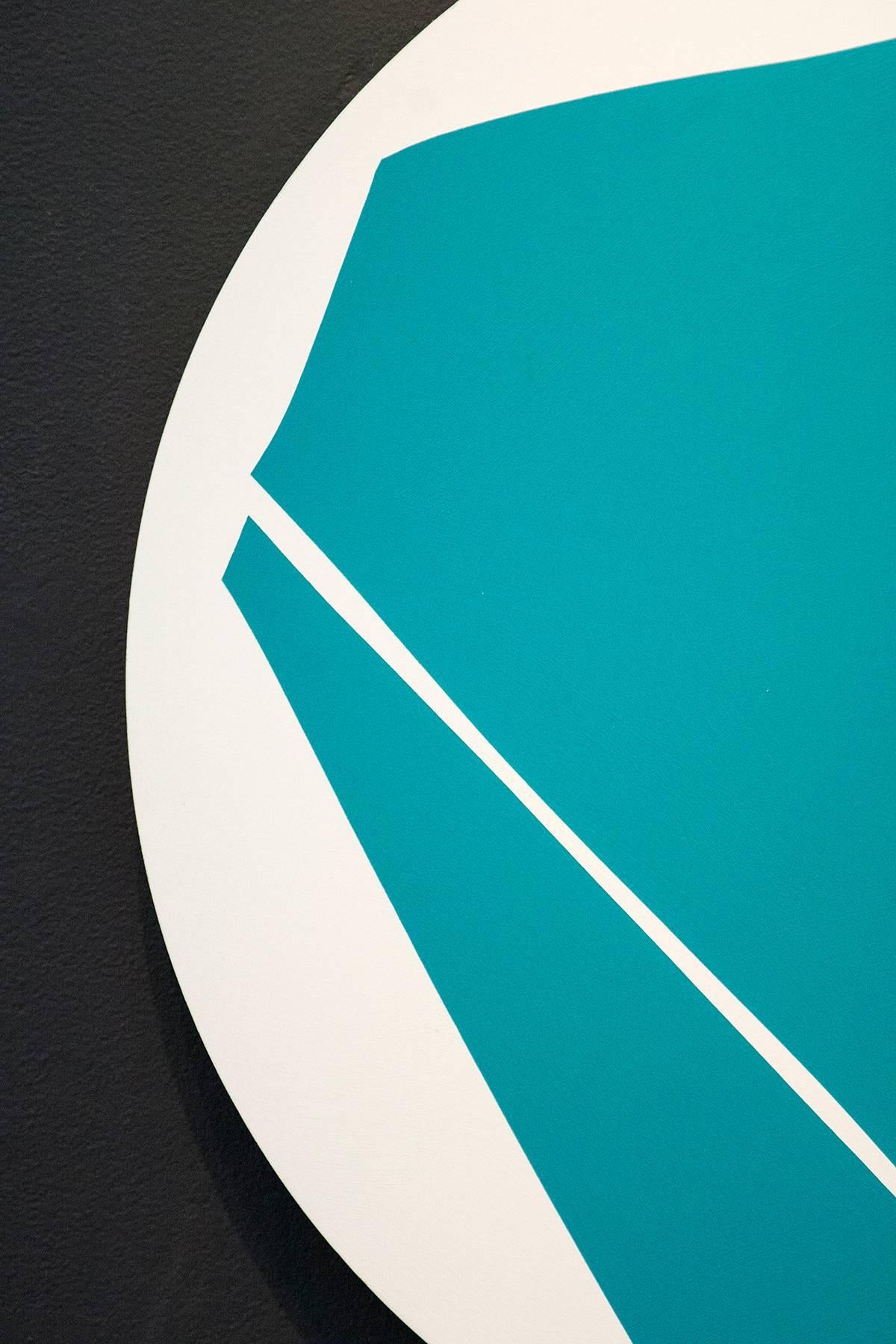 This bold, graphic-based painting of an aqua polygon on a round, white panel is rimmed with gold leaf. The gold casts glowing highlights like a halo around this dynamic tondo that sits about two inches away from the wall. Hill's lively work recalls