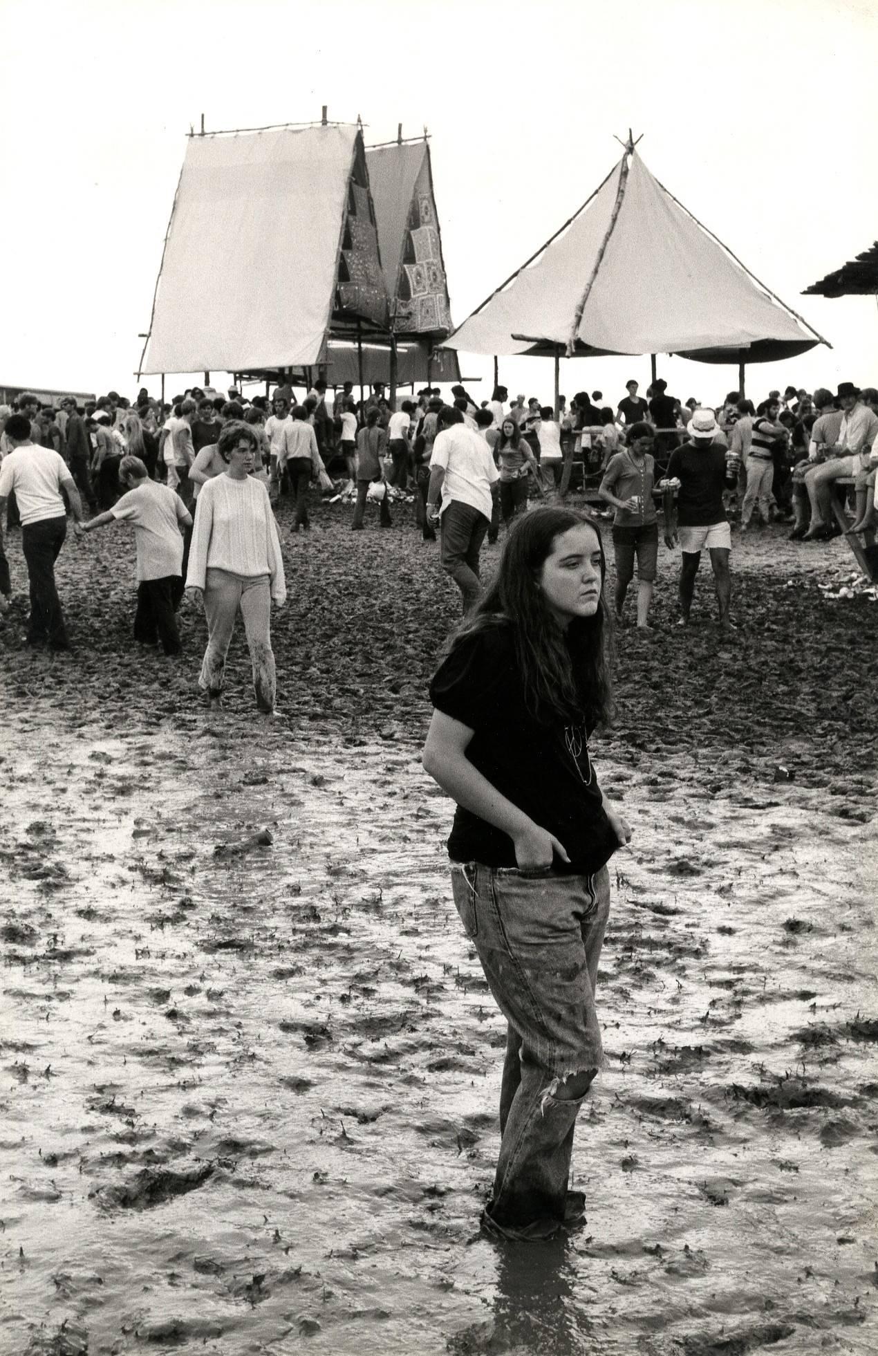 Burk Uzzle Black and White Photograph - Woodstock (girl standing in mud)