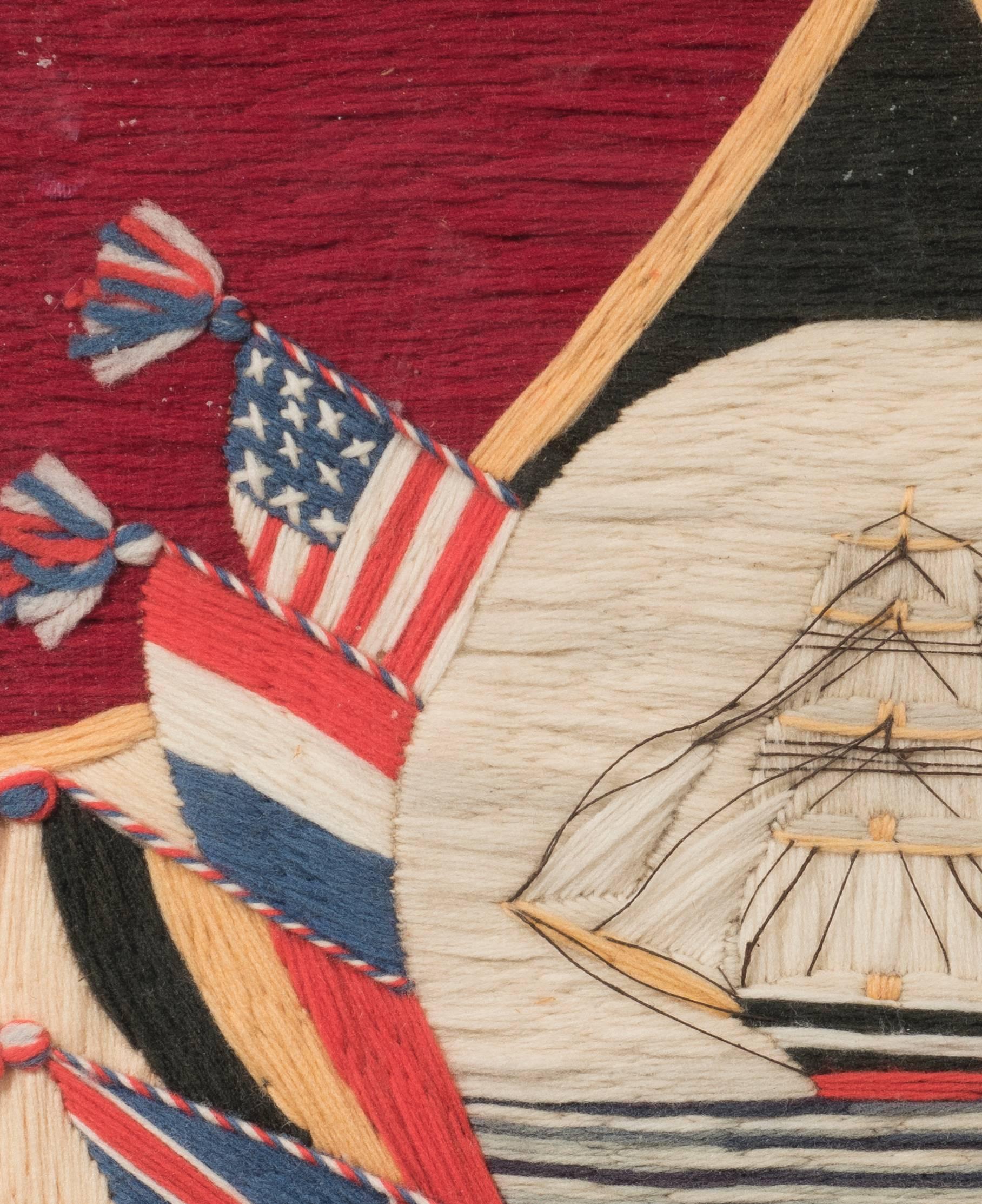 Worked in Woollen Threads featuring a masted British shop surrounding by draped flags. 

Mounted, glazed and framed

