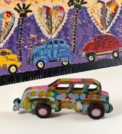Escultura vintage de un coche de tres ventanas, tallada a mano y pintada en madera, de Frank Romero