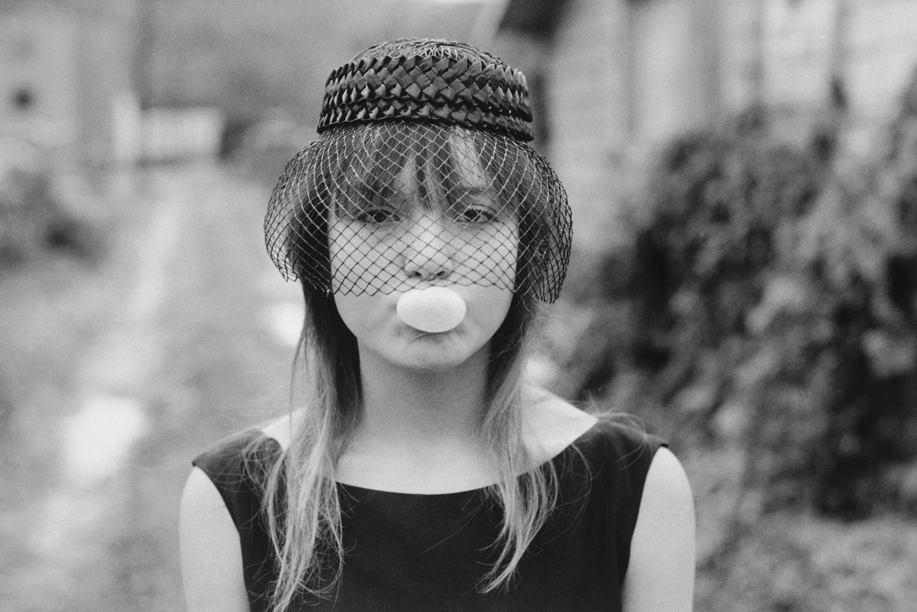 Mary Ellen Mark Black and White Photograph - Tiny blowing a bubble, Seattle, 1983