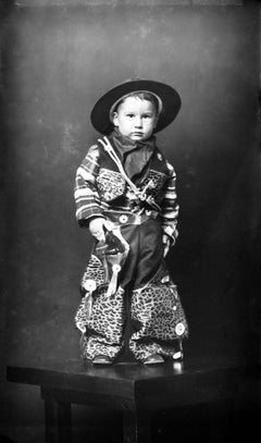 Retro Young Boy in Leopard Print Cowboy Costume and Hat, Standing
