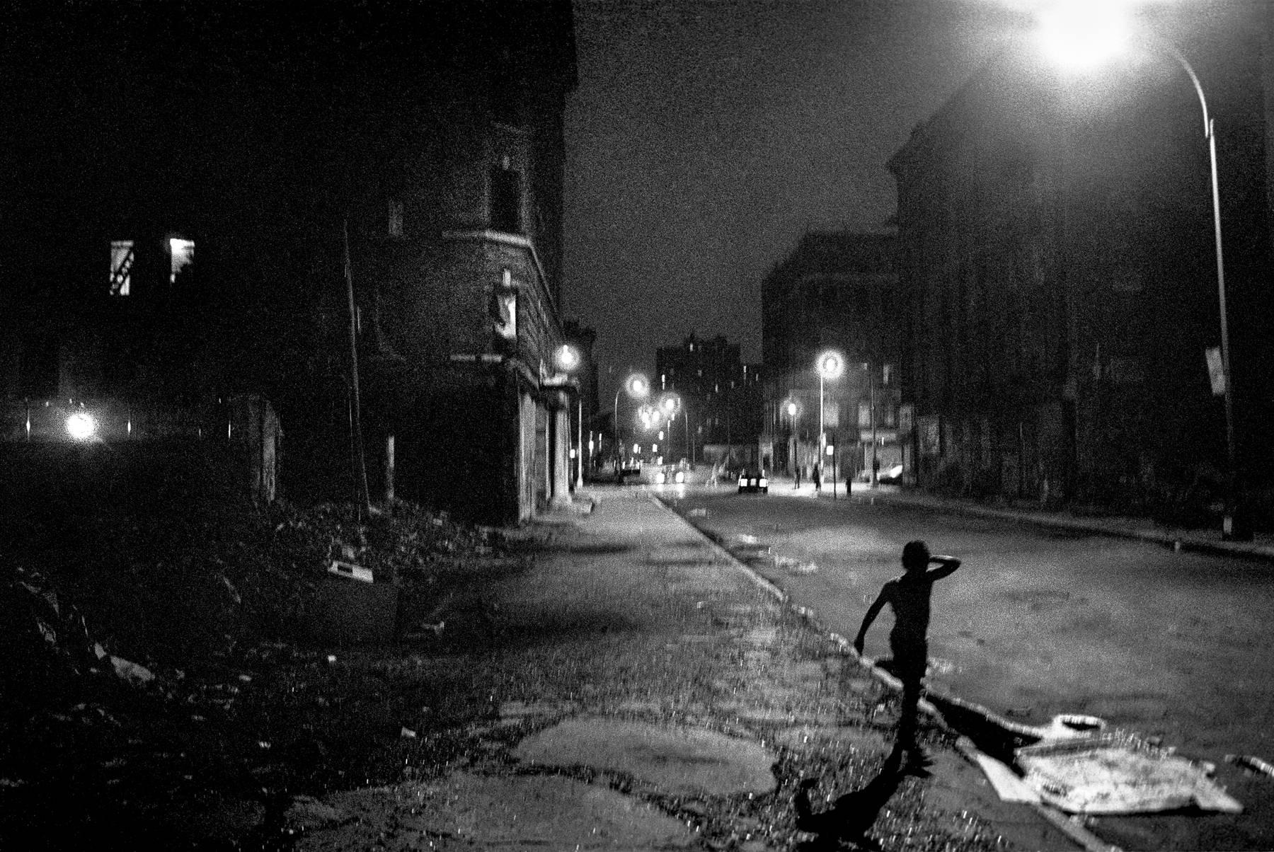 Ken Schles Black and White Photograph - Boy on East 5th Street, 4th of July