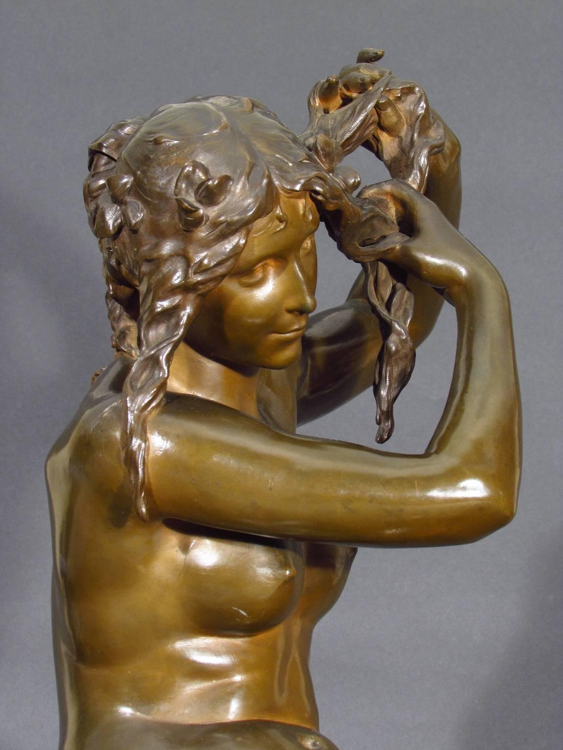 Antique French-School Ninteenth Century nude bronze sculpture by award-winning sculptor Hector Lemaire (1846-1933).

 Superbly detailed cast bronze of an allegorical representation titled Le Matin of a seated young maiden arranging her hair. One