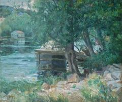 River landscape with a houseboat anchored, signed oil by German-French Albers