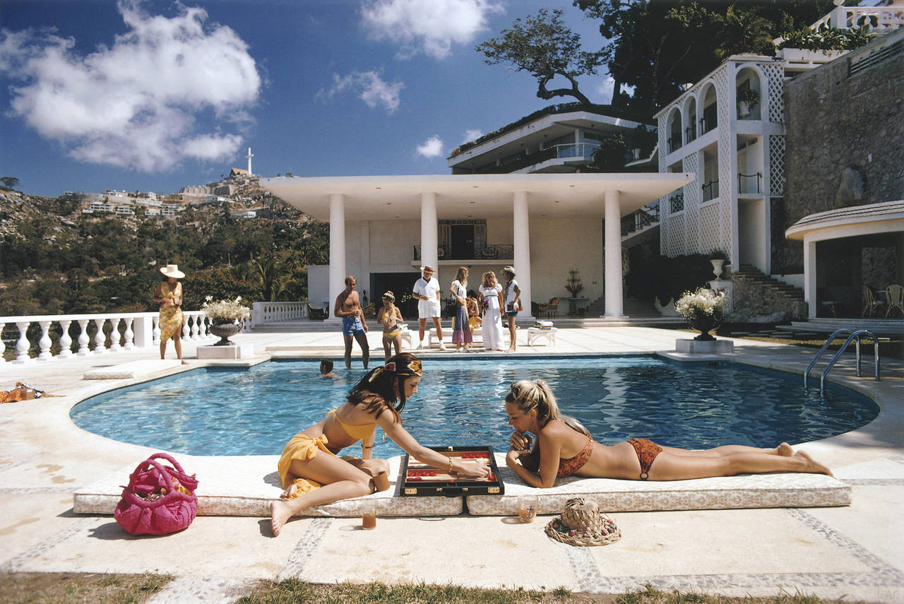 Slim Aarons Color Photograph - Poolside Backgammon (Aarons Estate Edition)