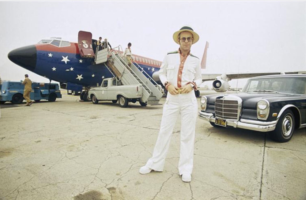 Terry O'Neill Color Photograph - Elton John and his Airplane, Los Angeles, CA.