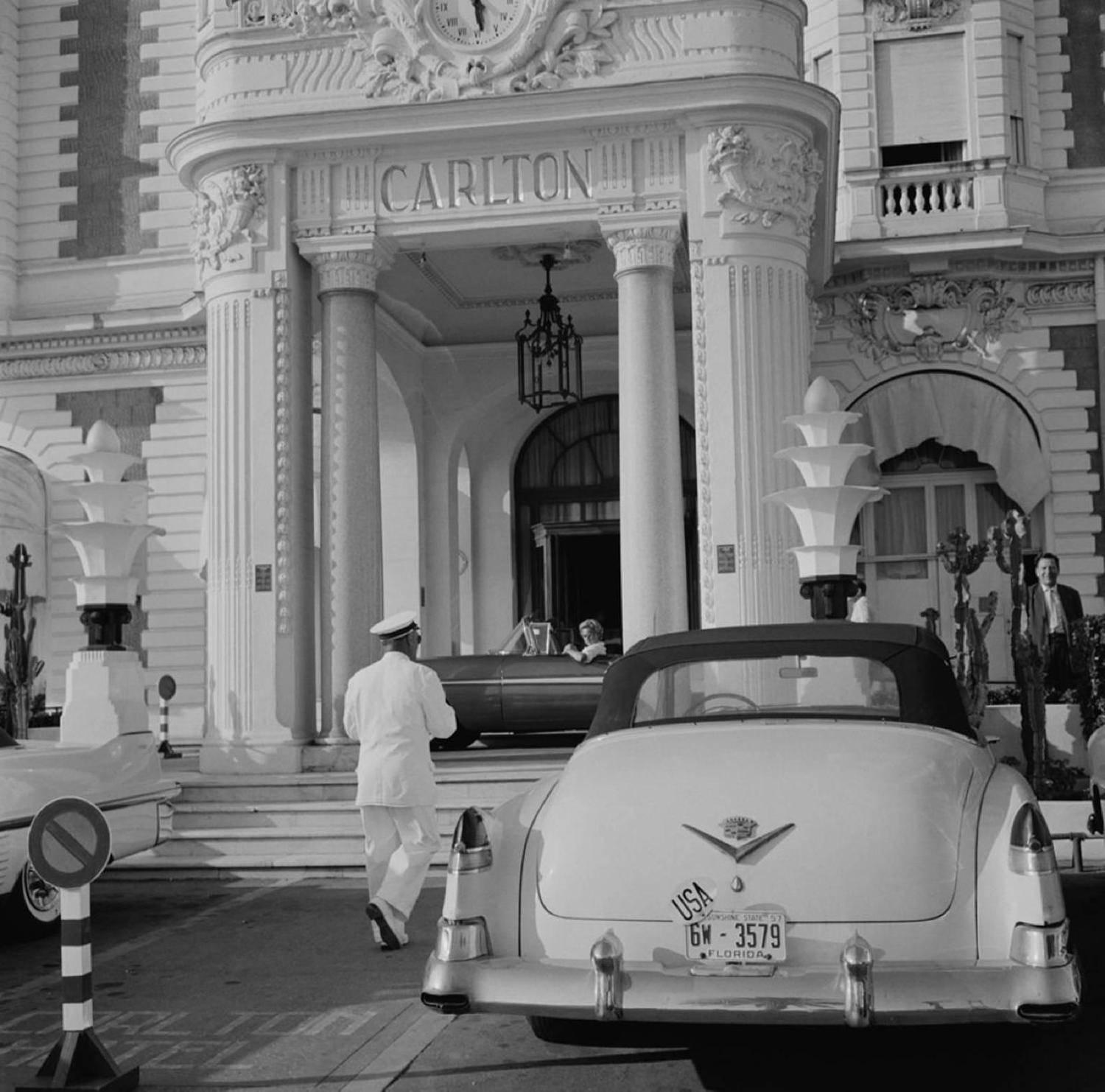 A Cadillac with Florida plates parked outside the Carlton Hotel, Cannes, France, circa 1955.

Estate stamped and hand numbered edition of 150 with certificate of authenticity from the estate.   

Slim Aarons (1916-2006) worked mainly for society