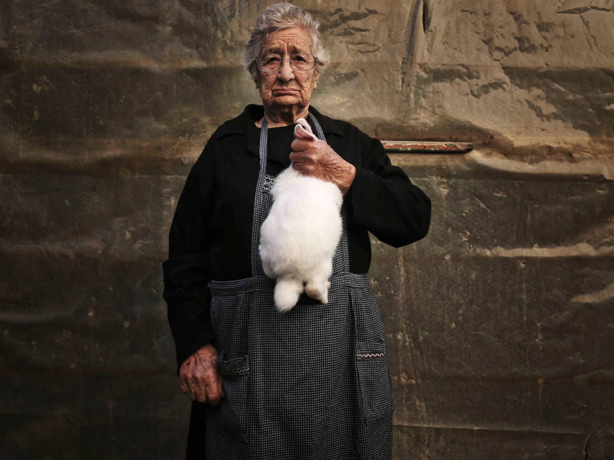 Stratis Vogiatzis Portrait Photograph - Kampos Project 2 (Woman with Rabbit)