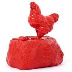 Chicken on rock.