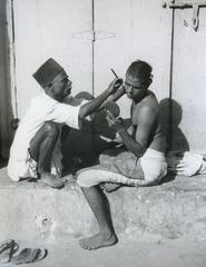 Vintage Street barber in Bombay