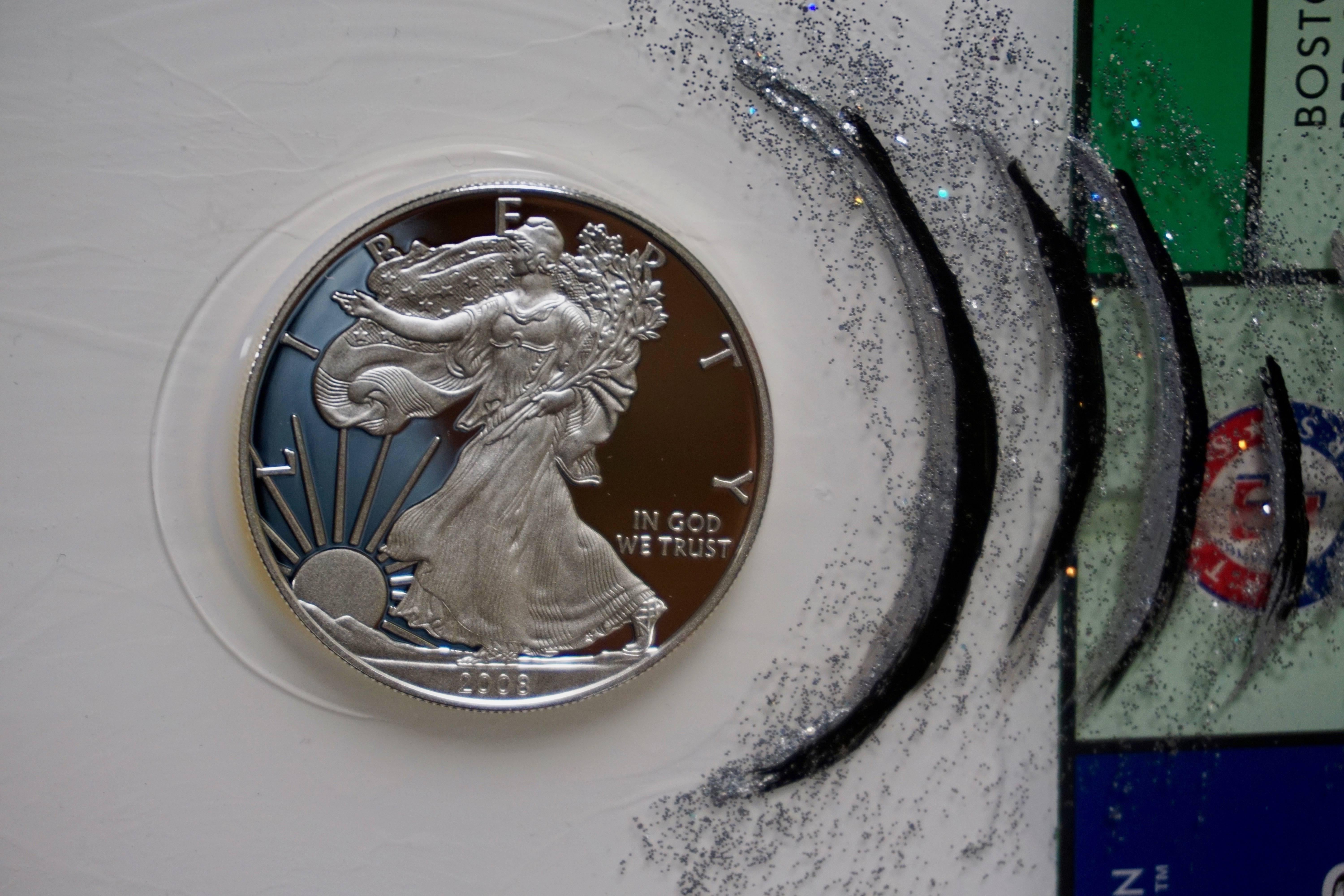 The background for this piece is layered with monopoly title deeds, chance, and community chest cards. The piece itself is created with metal flake and acrylic paint all of which is painted on a monopoly board embossed on canvas. It is protected