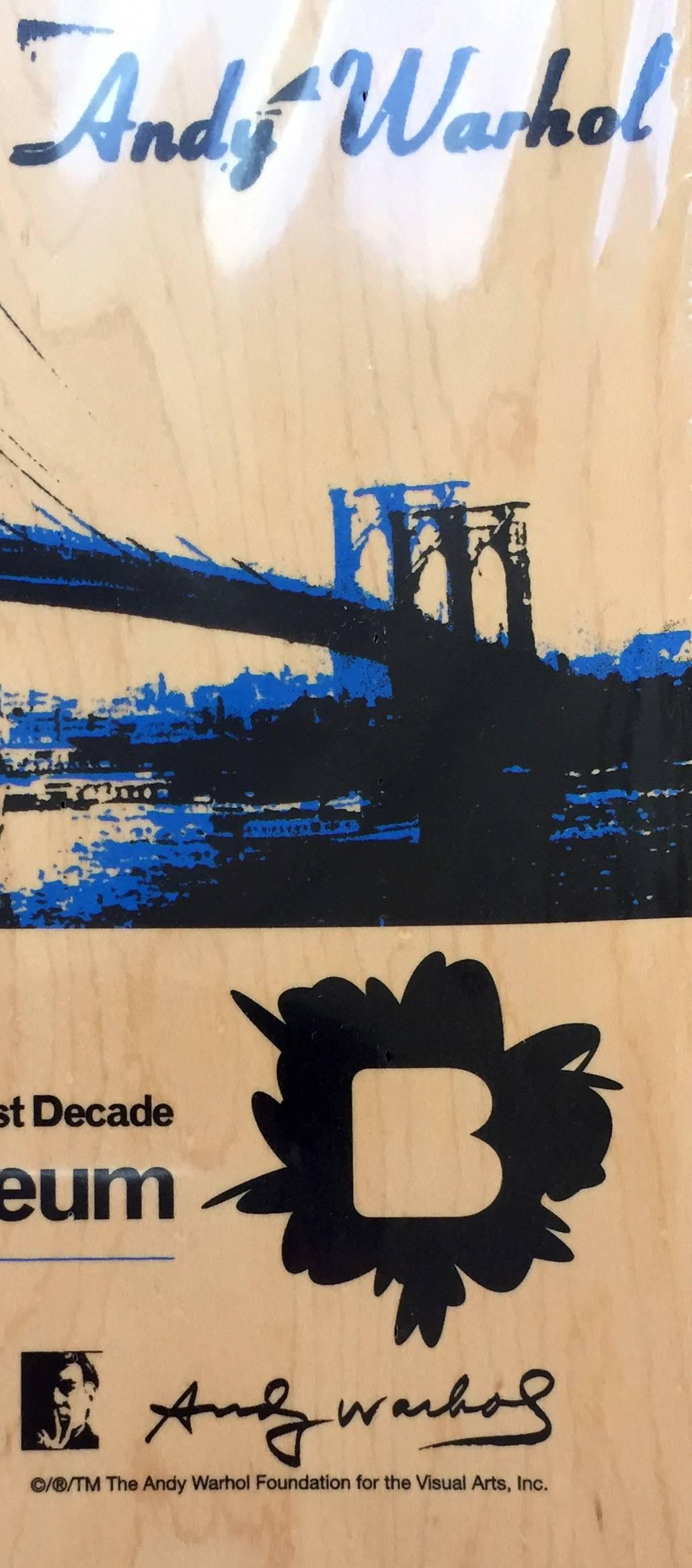 Rare Andy Warhol Brooklyn Bridge Skate Deck New in its original packaging. This limited edition deck was produced in conjunction with the 2010 Brooklyn Museum exhibit: Andy Warhol: The Last Decade. A 2010 collaboration between the Brooklyn Museum, 