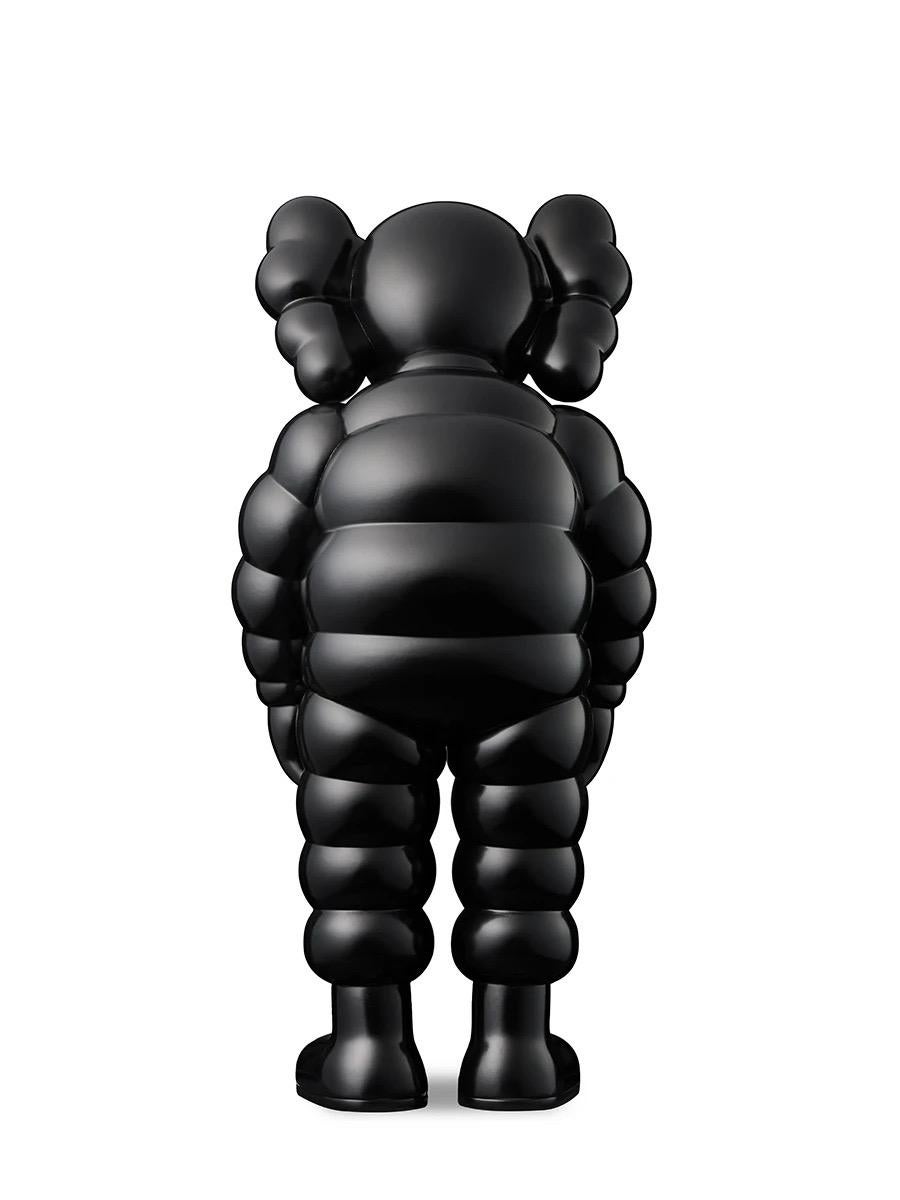 KAWS WHAT PARTY Black: 
This KAWS Companion vinyl sculpture features KAWS' signature CHUM character in a sloping position. Published to commemorate the debut of KAWS’ larger scale sculptural version of same at K11 Musea Hong Kong. New in original