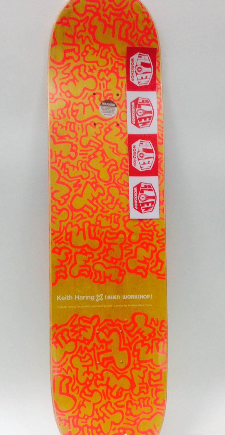 Rare Out of Print Keith Haring Skate Deck featuring some of the artist's most iconic images.

This work originated circa 2013 as a result of the collaboration between Alien Workshop and the Keith Haring Foundation. The deck is new and in its