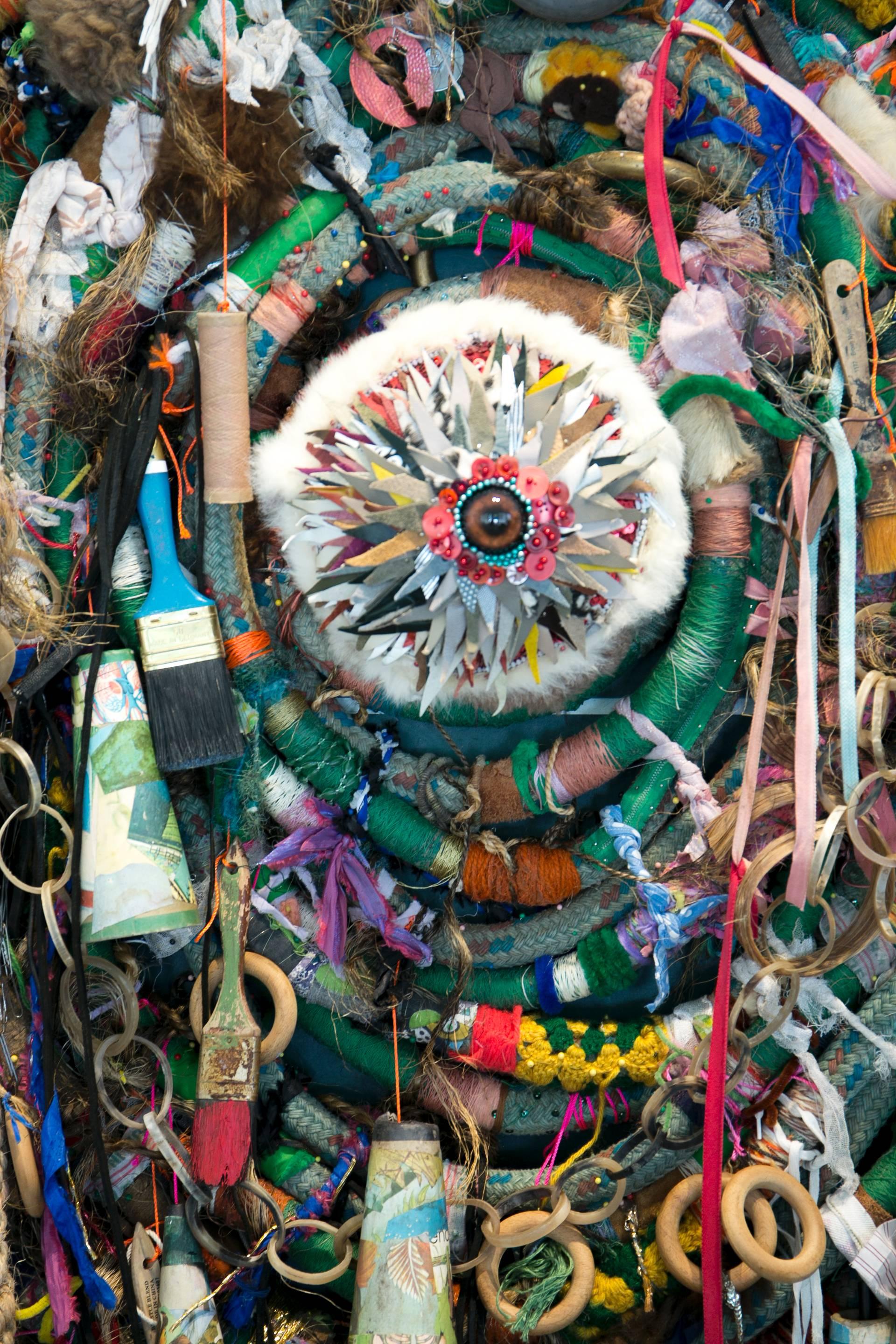 Marcus Kenney's assemblage, Eyeno is made of found objects such as an old ping pong table, nails, and many other items. 

Marcus Kenney's mixed media paintings and sculptures with found objects are well known and critically acclaimed. His