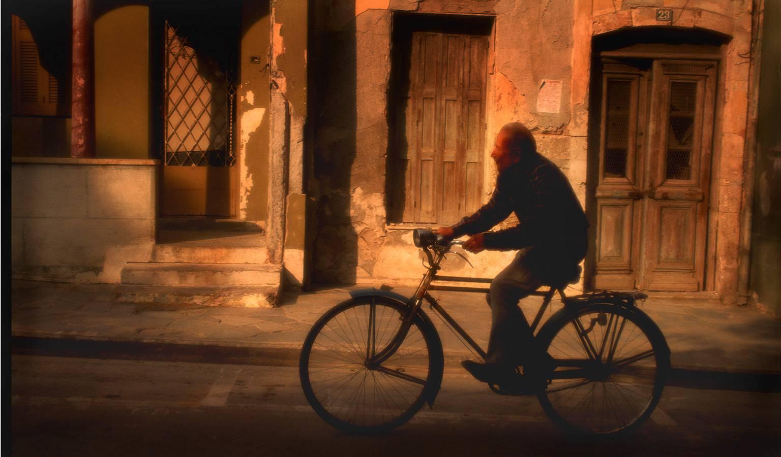 George Simhoni Color Photograph - Man on Bike, Crete
