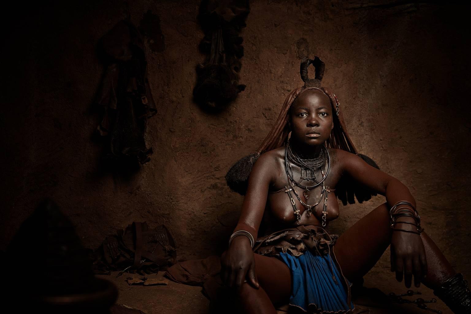 Chris Gordaneer Color Photograph - Himba Woman, Epupa Falls.