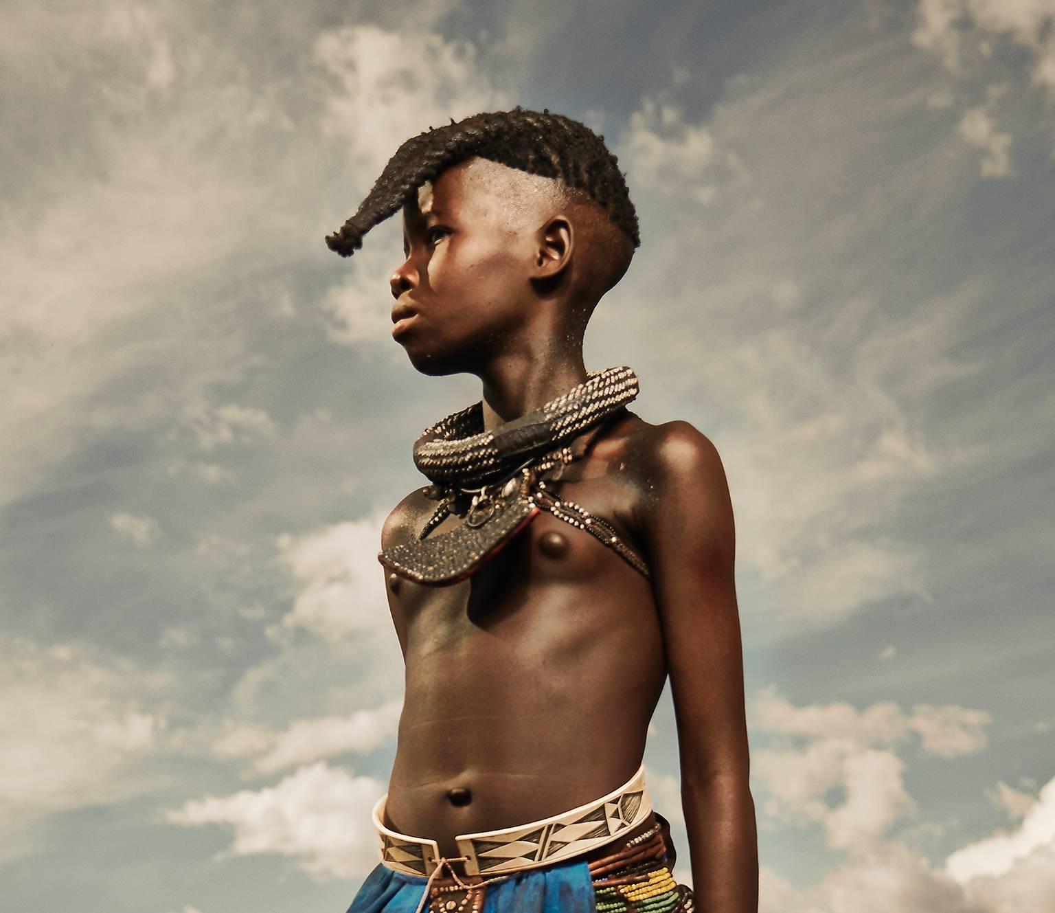 Himba Girl, Epupa Falls. - Photograph by Chris Gordaneer