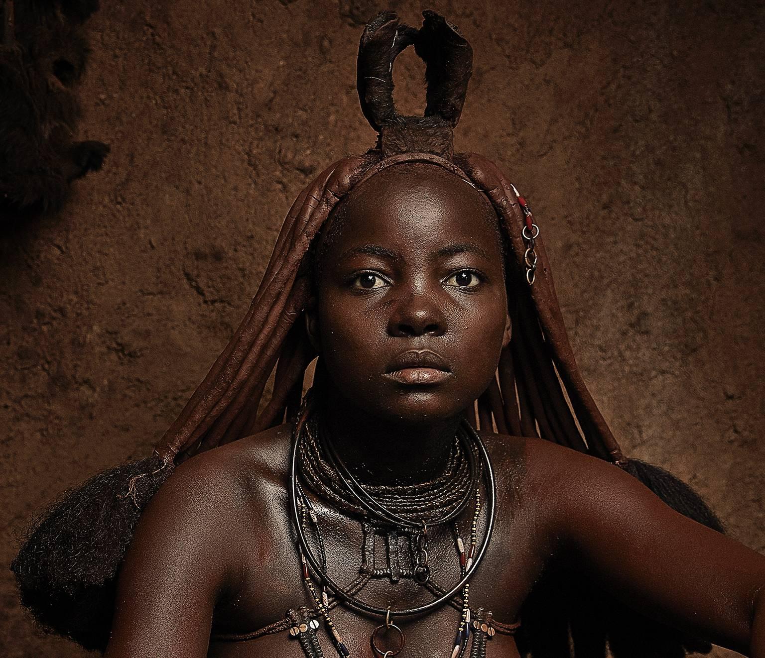 Himba Woman, Epupa Falls. - Photograph by Chris Gordaneer