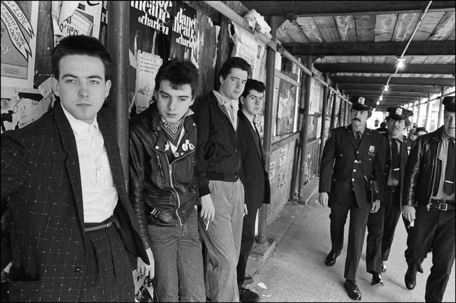 The Cure gets caught on Columbus Ave., NYC by Allan Tannenbaum