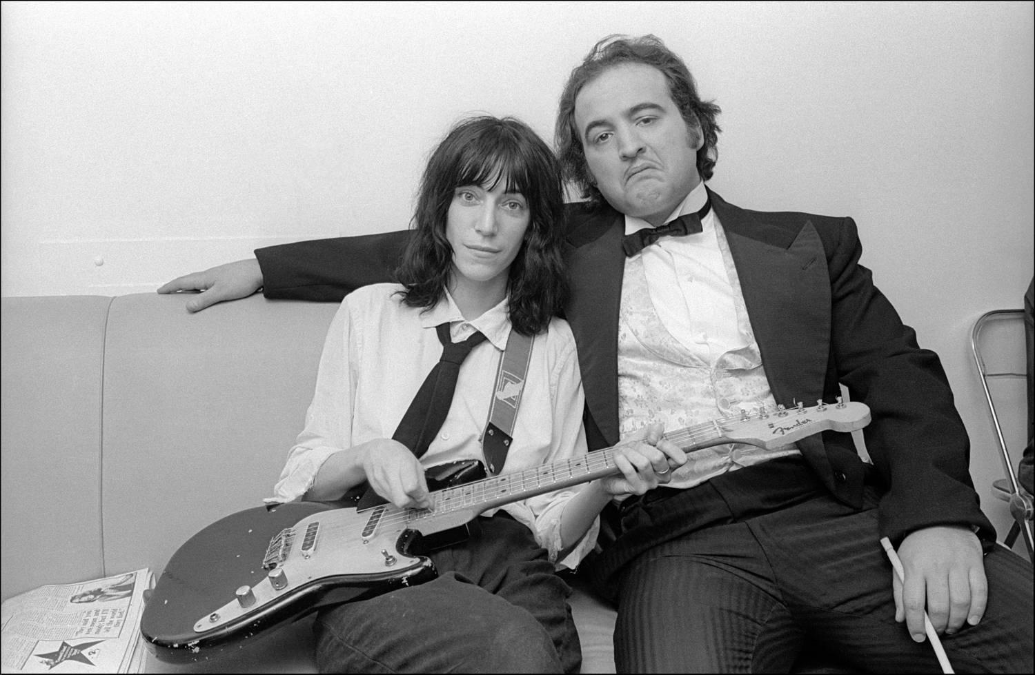 Allan Tannenbaum Black and White Photograph - Patti Smith and John Belushi backstage at Saturday Night Live, 1976