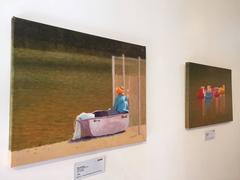 Homme dans un bateau à rames