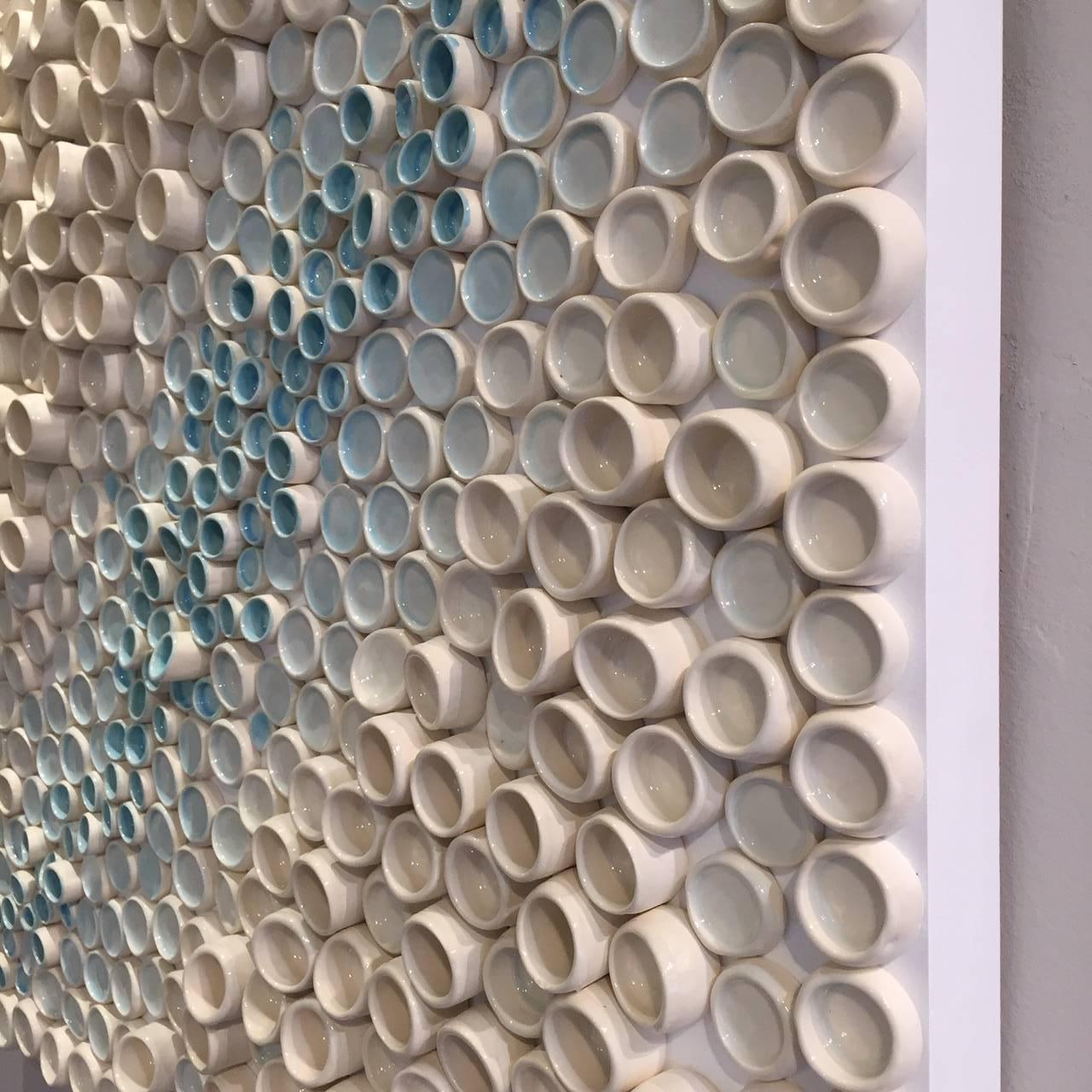 Sea blue green and creamy white low fired glazed ceramic on wood sculptural wall work of art from Pop Art pioneer Jane B. Grimm, whose artistic career began in the 1960’s, when her free-form sculptural jewelry exploded onto the fashion scene in NYC.