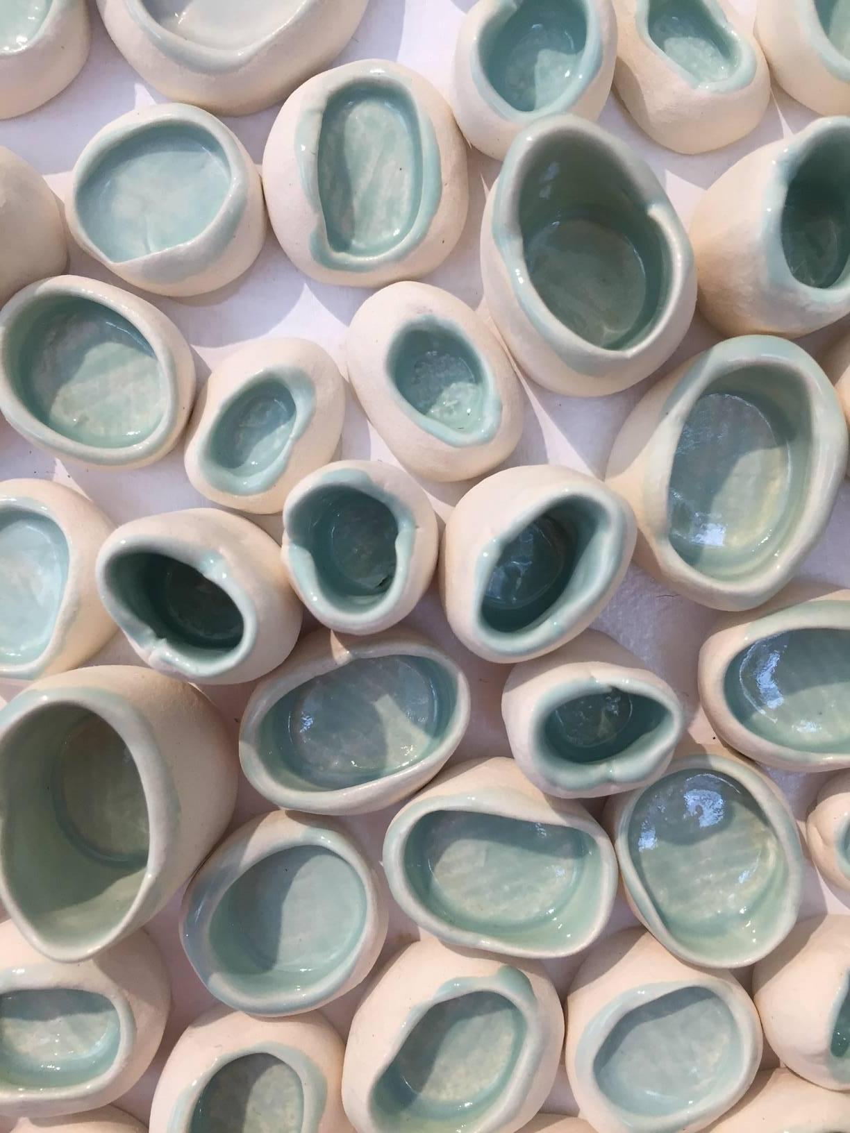 Celadon blue organic natural zen abstract ceramic wall sculpture from Pop Art pioneer Jane B. Grimm, who began her artistic career in the 1960’s, when her free-form sculptural jewelry exploded onto the fashion scene in NYC. Her designs spoke to a