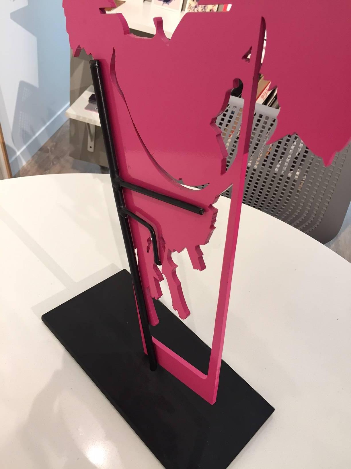 Pink laser cut steel sculpture that can sit on a table or pedestal, or directly on the floor. ltd edition; one of three sculptures were created. The dynamic and wonderful work casts glorious shadows that are reminiscent of Bukovnik's  iconic