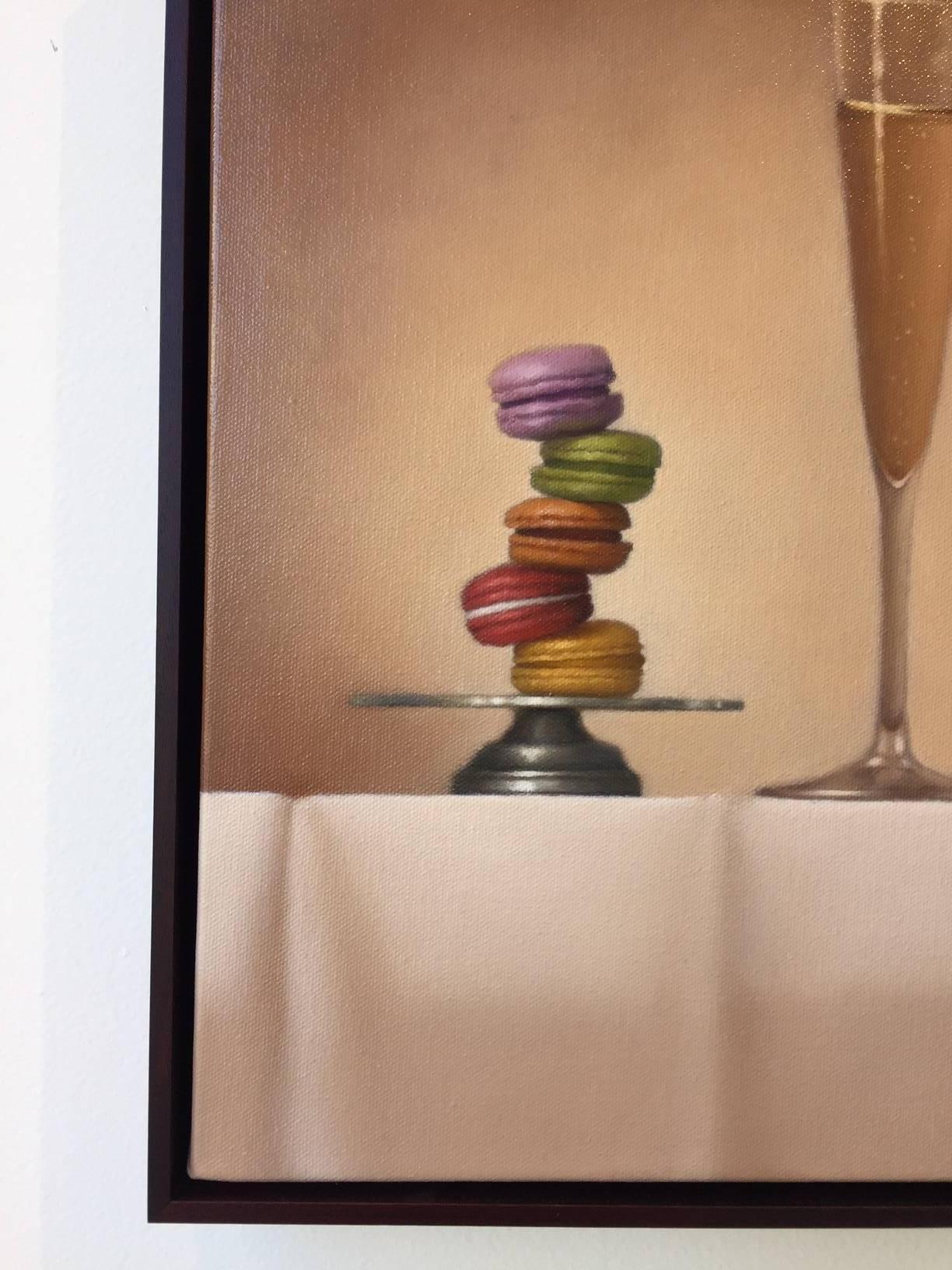 Champagne and French macarons stacked on a silver platter are featured in this delightful still life composition, 'French Toast', oil painting on linen. 

Mimi Jensen uses bold colors to depict theatrically lit objects. Her paintings invite
