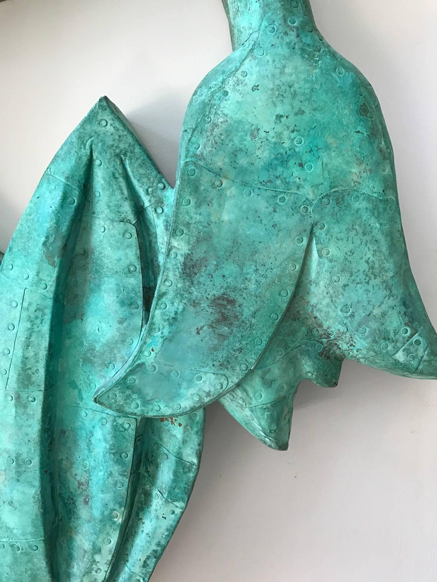 Dawn Southworth, Forget-Me-Nots, 38" x 32" x 4", patinated copper over wood

"Forget Me Nots" is a floral wall sculpture covered in bright hues of blue and green patinated copper. This wall sculpture is suitable for indoor