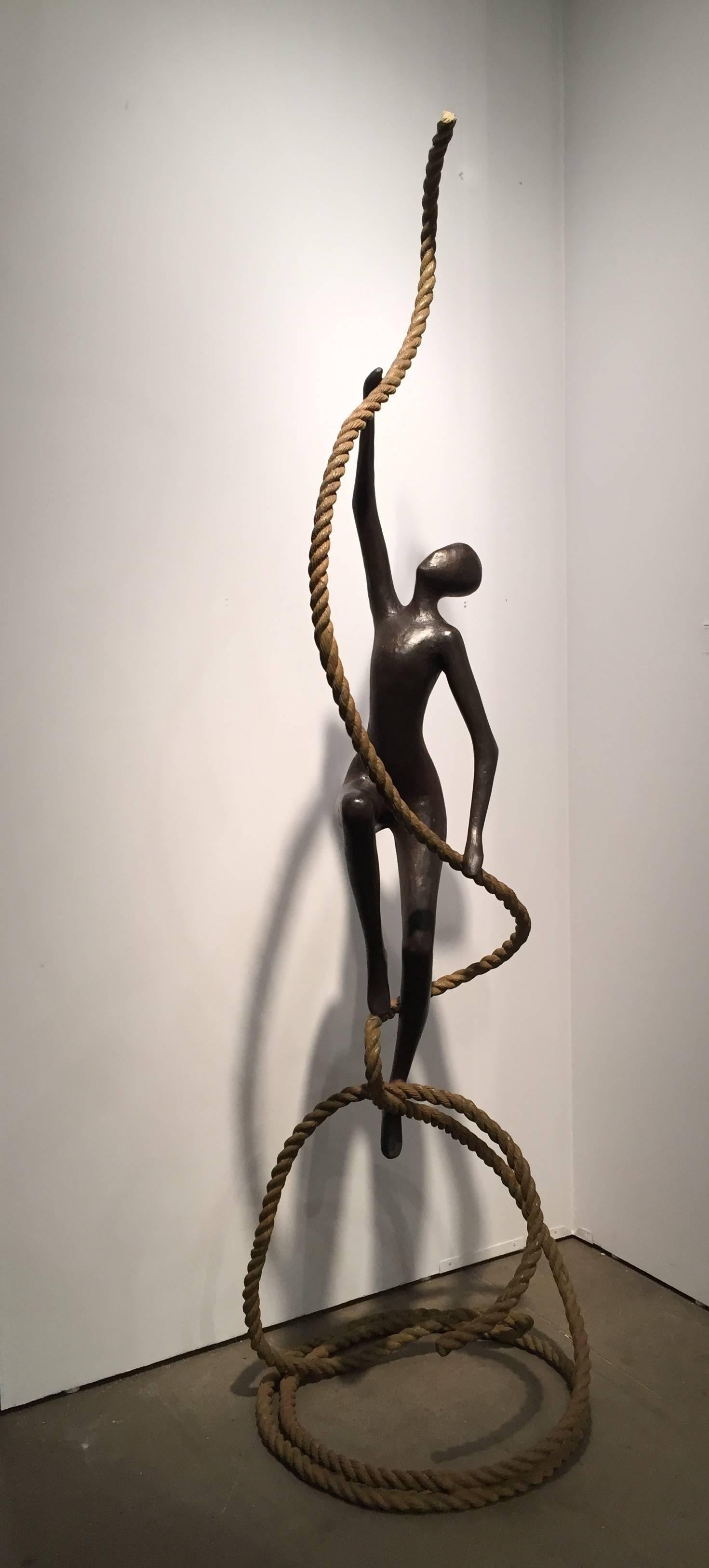 Tolla, one of the most popular artists working today, created this bronze large scale new sculpture with a single character gliding up a coiled rope, which is a classic motif for this artist. This outdoor or indoor work is entirely made of bronze,