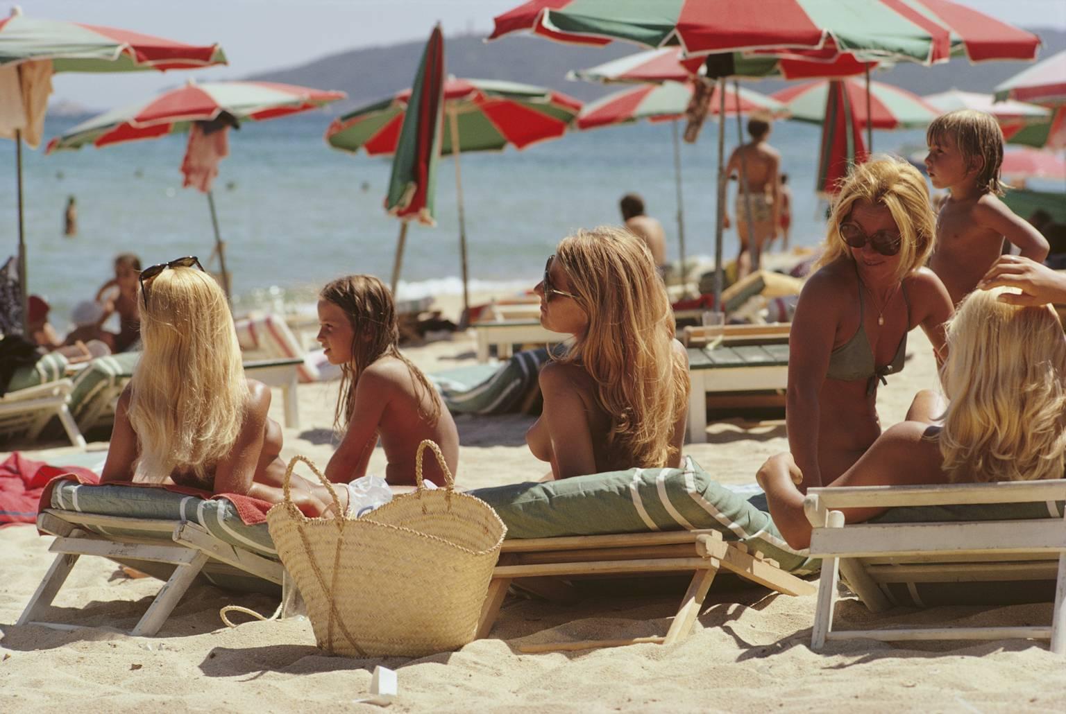 Slim Aarons Figurative Photograph - 
Saint-Tropez Beach
 1971  (Estate Stamped Edition)